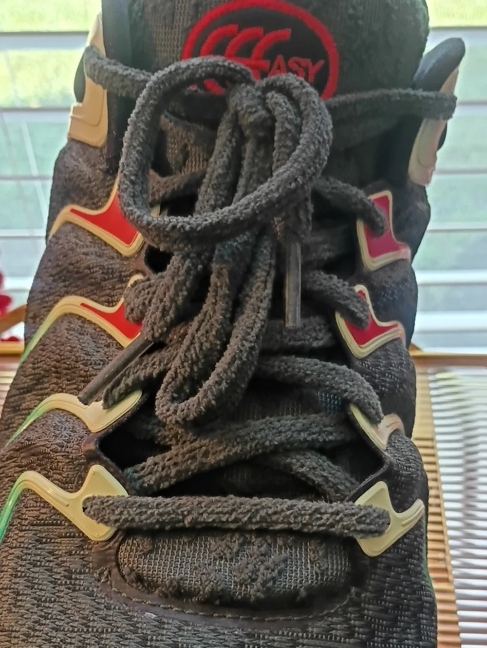 Nike Men’s Black Athletic Shoes with Green and Red Accents